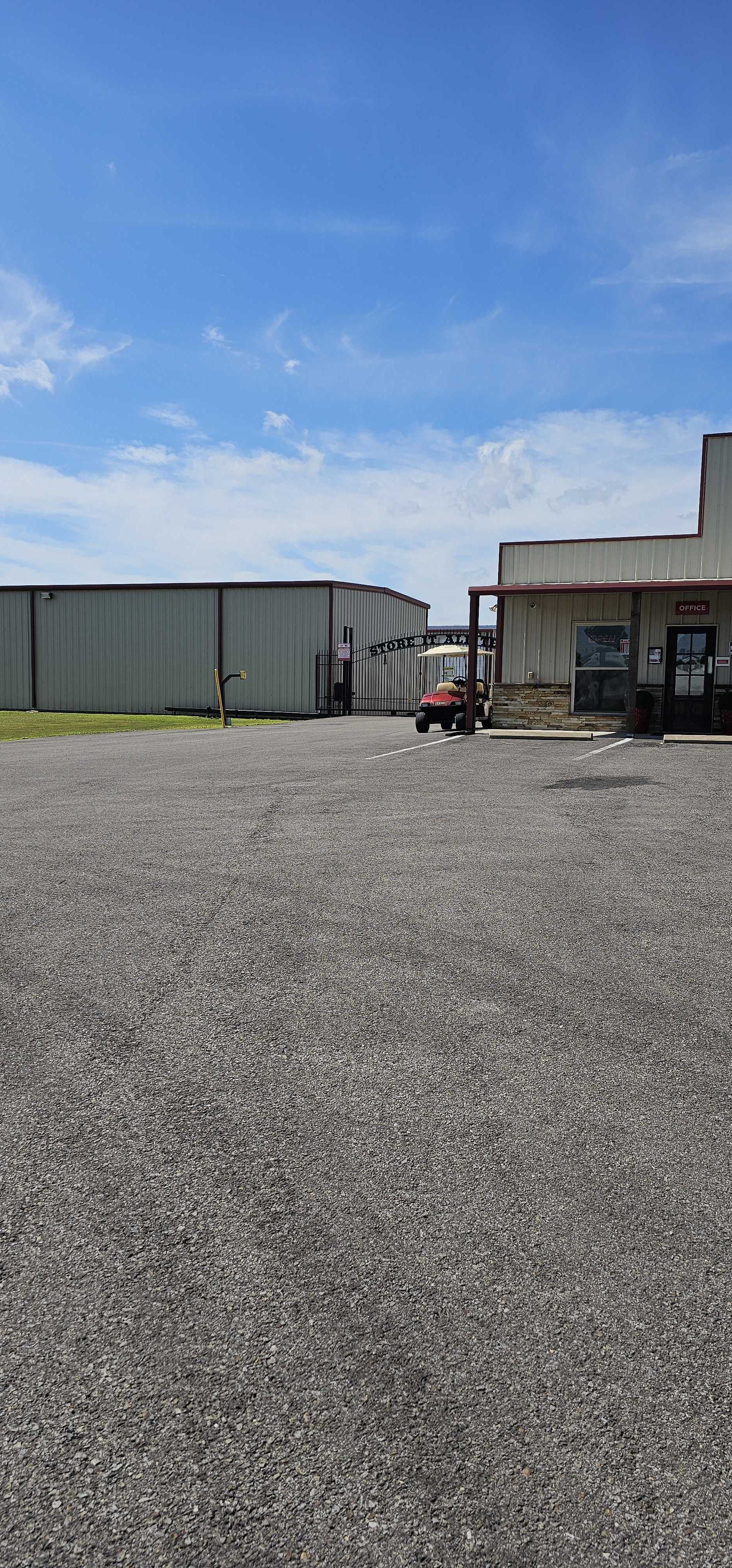 Front view of climate-controlled self storage facility in Caddo Mills with secure gated access and on-site office